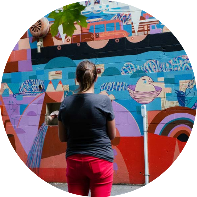 Woman looking at mural in Powell River